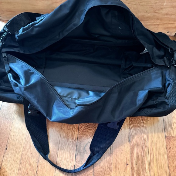LL Bean Black Adventure Rolling Duffle Bag.